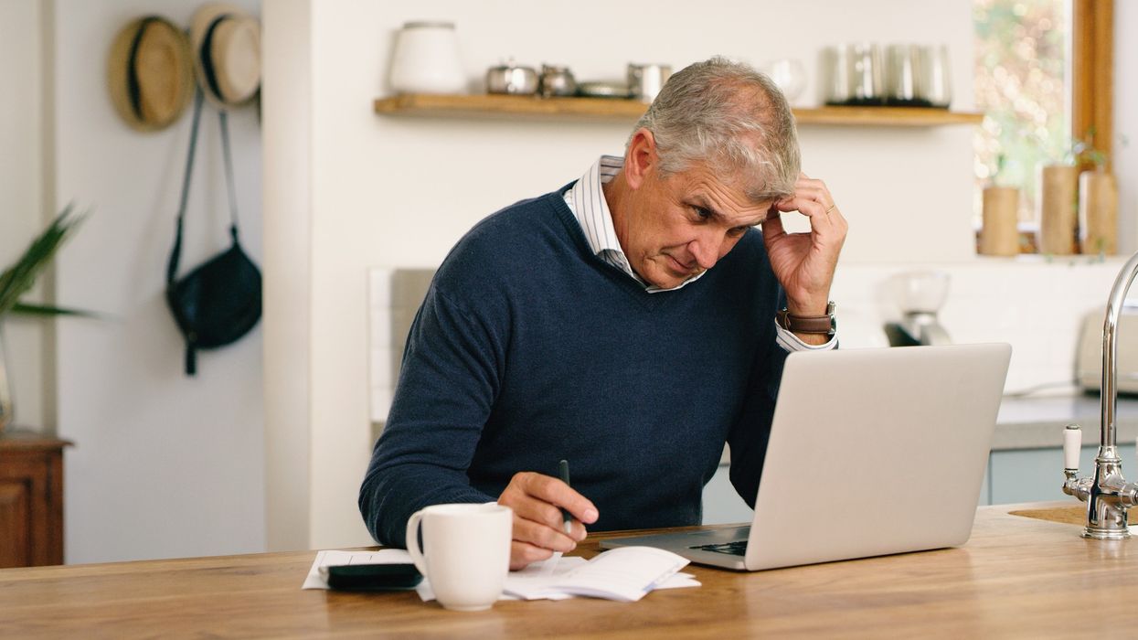 Man worried at laptop