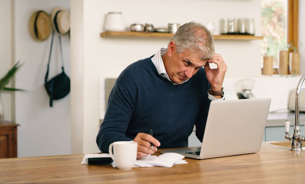 Man worried at laptop
