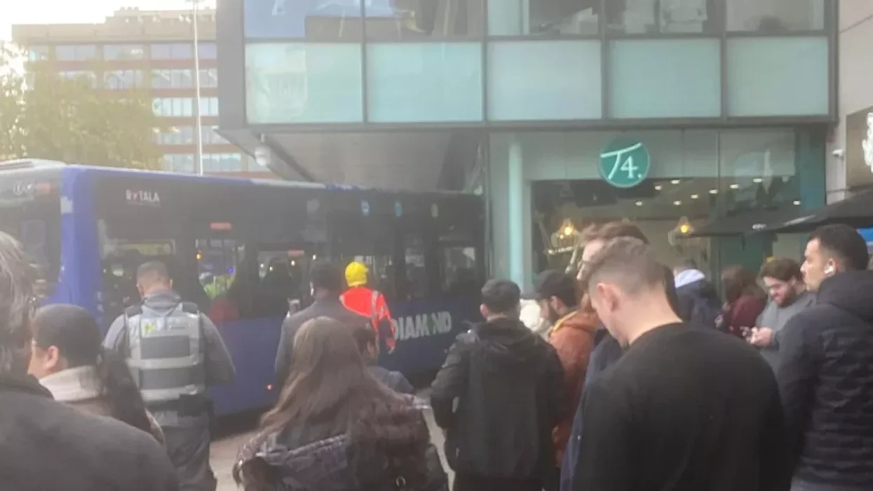 Manchester bus smashes into city centre building - emergency services rush to scene