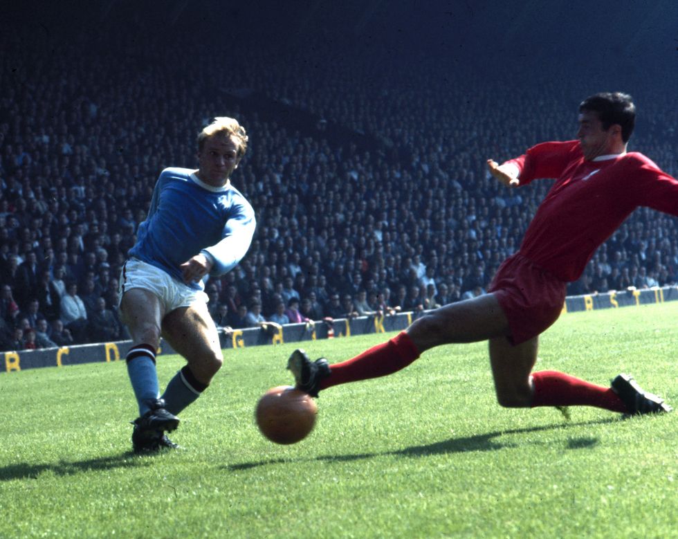 Manchester City forward Francis Lee in the City third kit challenges Phil Beal of Spurs during a First Division match at White Hart Lane