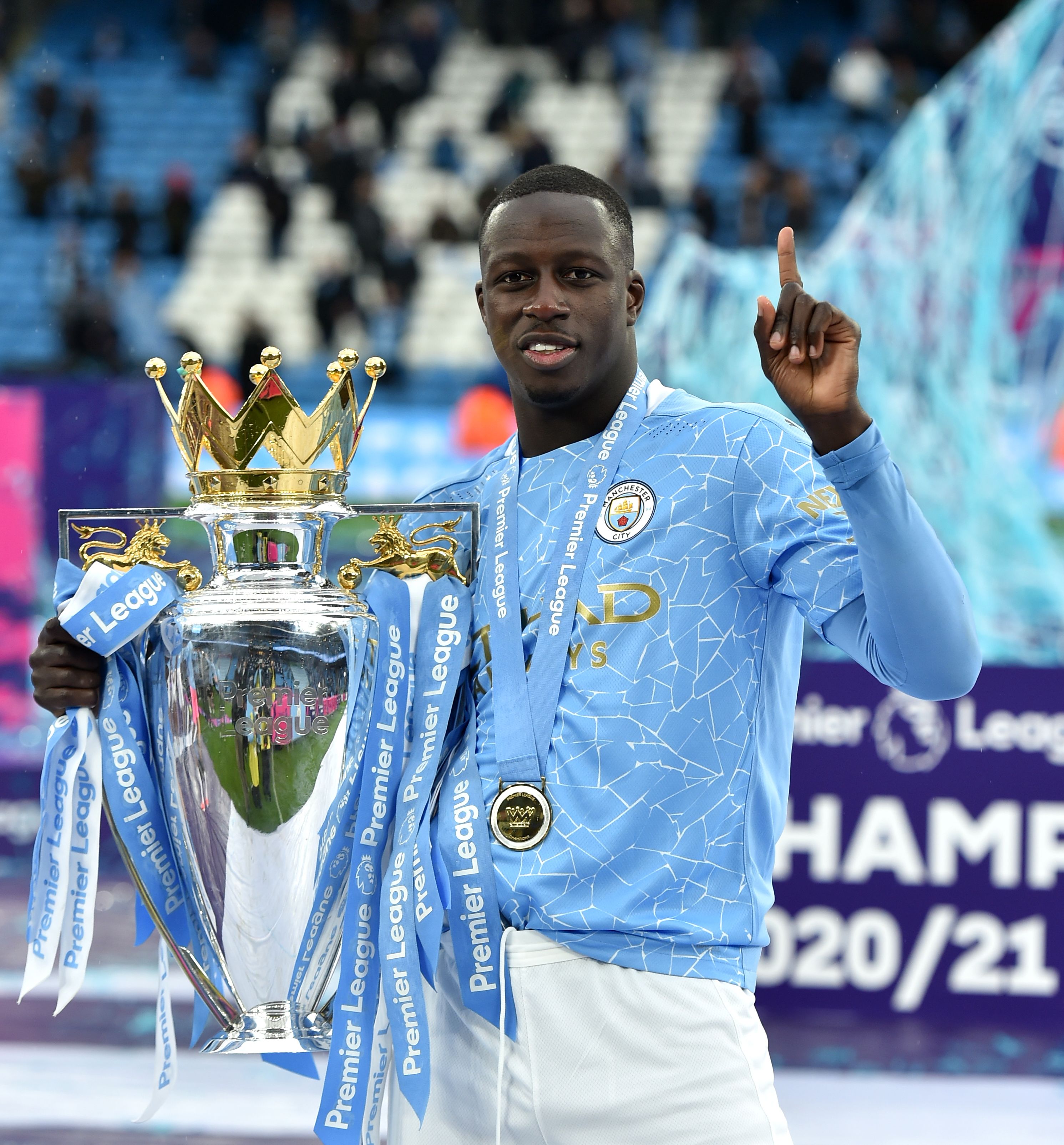 Manchester City's Benjamin Mendy celebrates with the Premier League trophy.