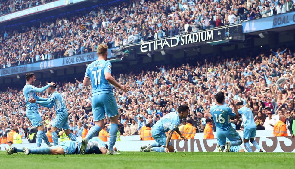 Manchester City's Ilkay Gundogan celebrates scoring their third goal with teammates