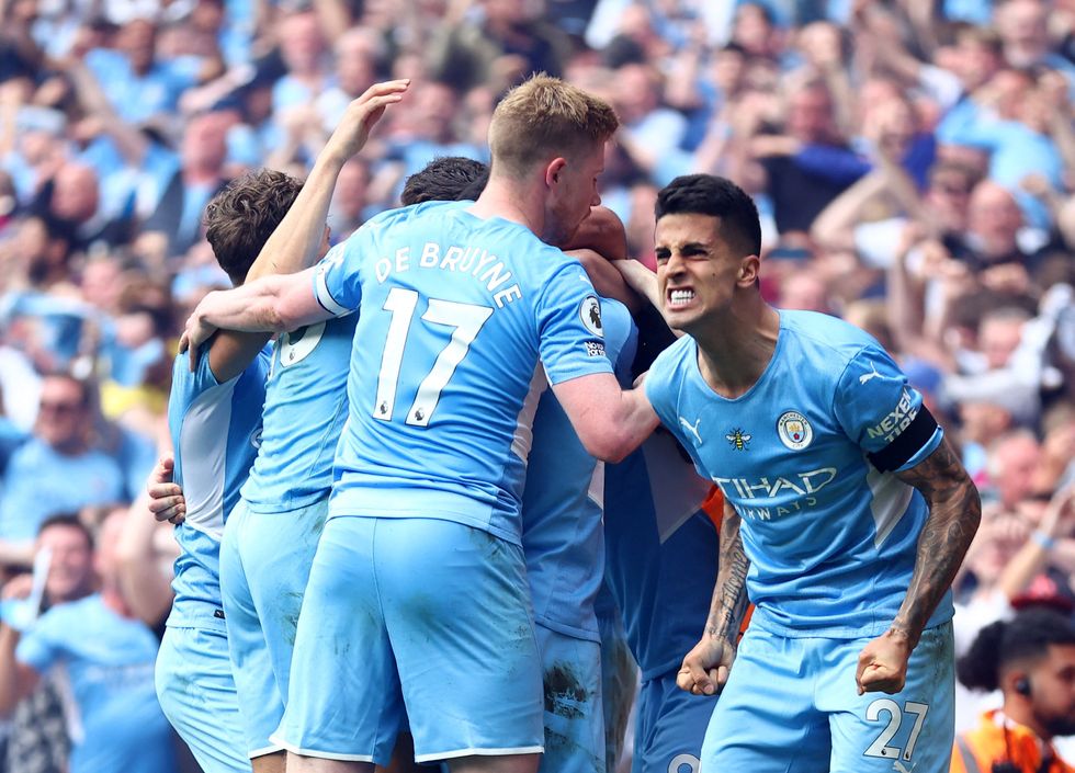 Manchester City's Joao Cancelo celebrates after Ilkay Gundogan scores their third goal