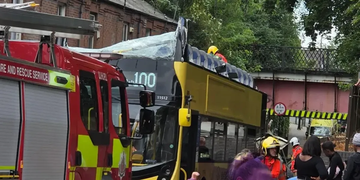 NextImg:Passenger critically injured as roof of double-decker bus torn off after striking bridge
