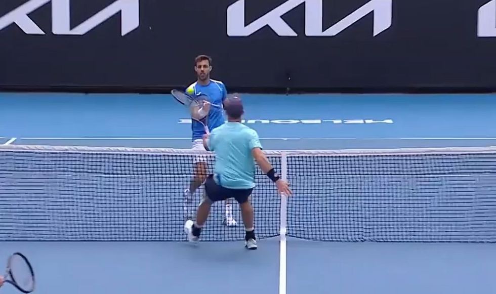 Marcel Granollers picked up the ball while the point was still live