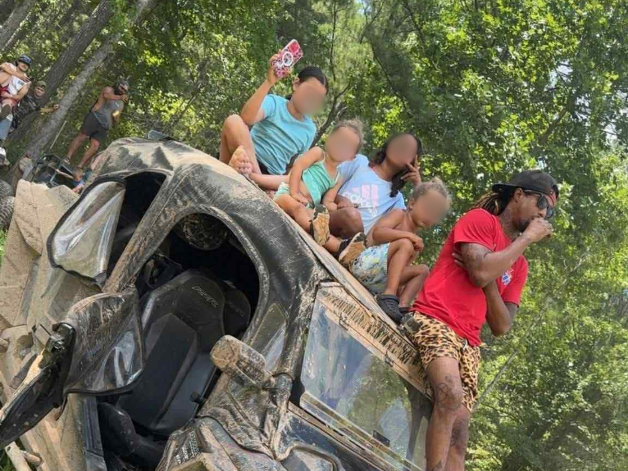 Marcus Ragland and some of his children aboard an ATV