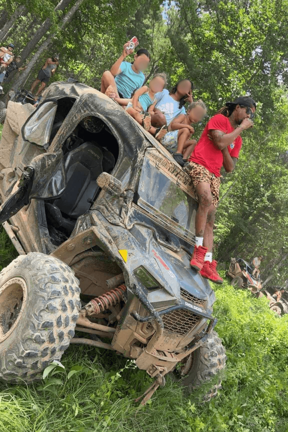 Marcus Ragland and some of his children aboard an ATV