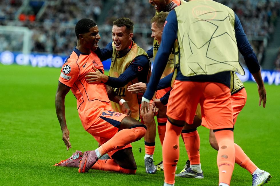 Marcus Rashford capped his best performance in a Barcelona shirt with two goals in a Champions League win over Newcastle \u2013 but his night ended in chaos as two pitch invaders tried to join in his Man of the Match presentation.