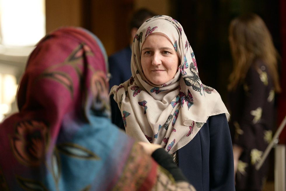 Maree Todd, Scottish Minister for Childcare and Early Years and MSP for Highlands and Islands, tries on a Hijab at a display in 2018