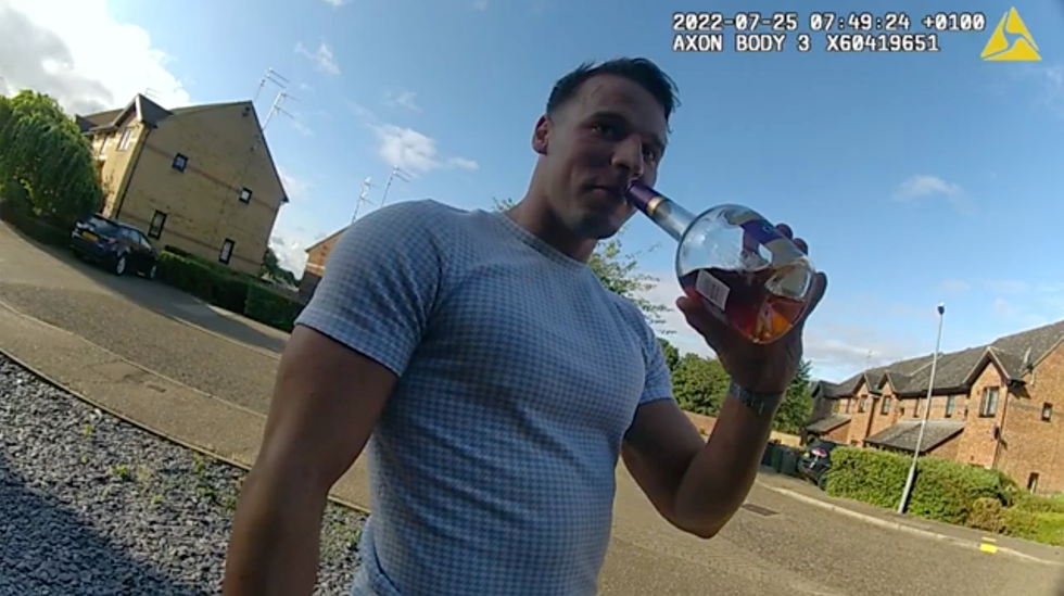 Marek Hecko drinking a bottle of brandy