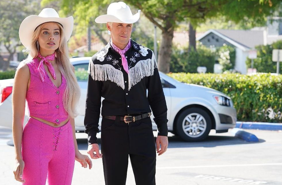 Margot Robbie as Barbie alongside Ryan Gosling
