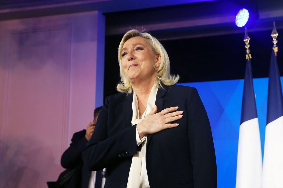 Marine Le Pen, French far-right National Rally (Rassemblement National) party candidate for the 2022 French presidential election, gestures after her defeat in the second round of the 2022 French presidential election, at the Pavillon d'Armenonville, in Paris, France, April 24, 2022. REUTERS/Yves Herman
