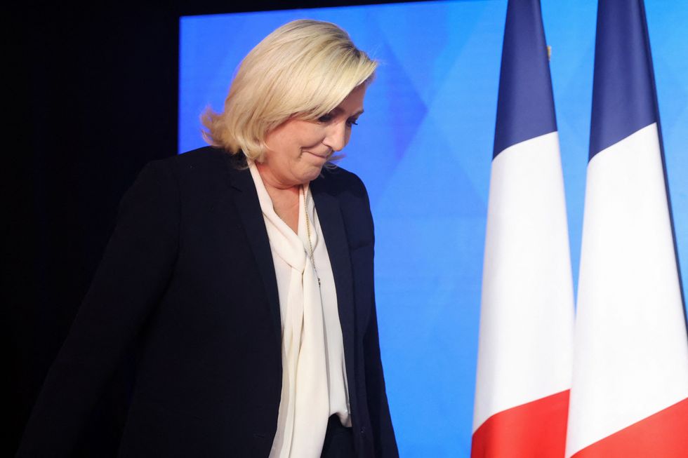Marine Le Pen, French far-right National Rally (Rassemblement National) party candidate for the 2022 French presidential election, looks down after her defeat in the second round of the 2022 French presidential election, at the Pavillon d'Armenonville, in Paris, France, April 24, 2022. REUTERS/Yves Herman