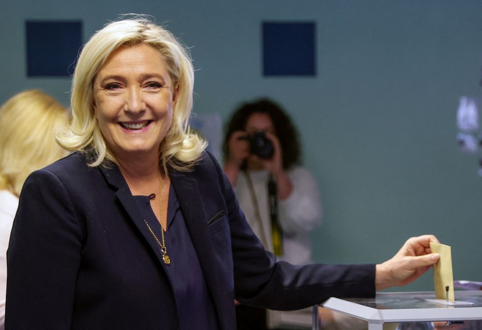 Marine Le Pen, French far-right National Rally (Rassemblement National) party candidate, votes in the second round of the French parliamentary elections, at a polling station in Henin-Beaumont.