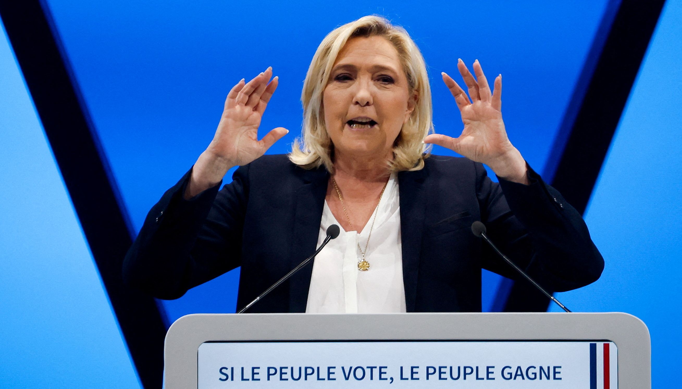 Marine Le Pen, leader of French far-right National Rally (Rassemblement National) party and candidate for the 2022 French presidential election, speaks during a political campaign rally in Perpignan, France, April 7, 2022. REUTERS/Albert Gea/File Photo