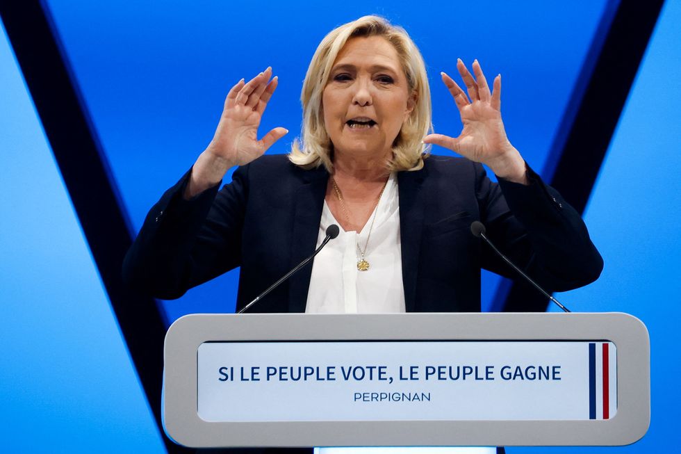 Marine Le Pen, leader of French far-right National Rally (Rassemblement National) party and candidate for the 2022 French presidential election, speaks during a political campaign rally in Perpignan, France, April 7, 2022. REUTERS/Albert Gea
