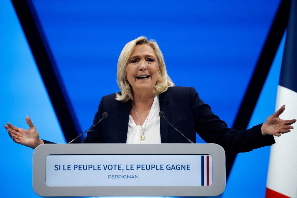 Marine Le Pen, leader of French far-right National Rally (Rassemblement National) party and candidate for the 2022 French presidential election, speaks during a political campaign rally in Perpignan, France