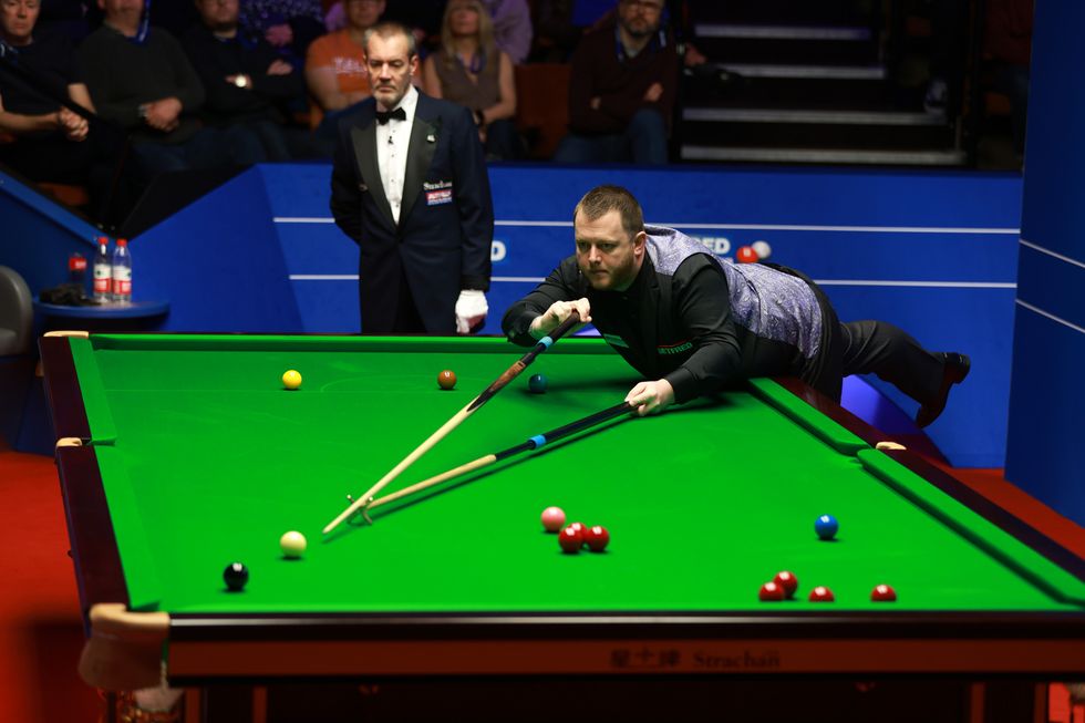 Mark Allen plays a shot during day seven of the Betfred World Snooker Championships at The Crucible, Sheffield. Picture date: Friday April 22, 2022.