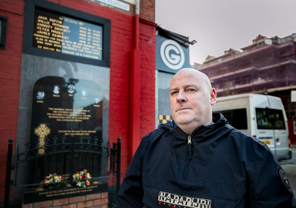 Mark Sykes stands at the memorial to those killed during the Sean Graham Bookmakers attack on 5 February 1992. Mark survived being shot four times during the attack which also claimed the life of his 18-year-old brother-in-law, Peter Magee.