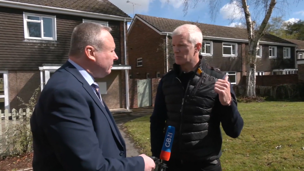 Mark White speaks to Al Carns