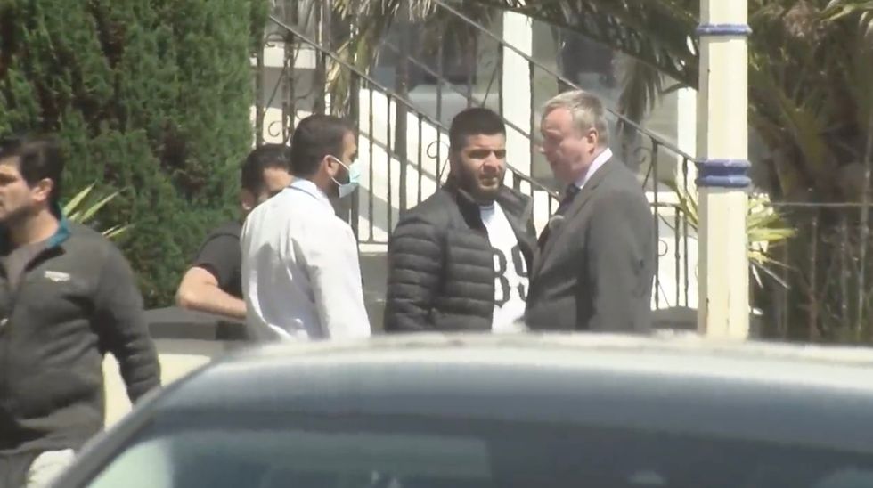 Mark White speaks to asylum seekers in Eastbourne