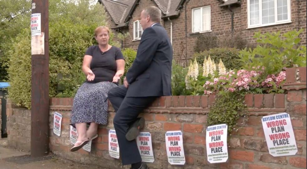 Mark White talks to residents