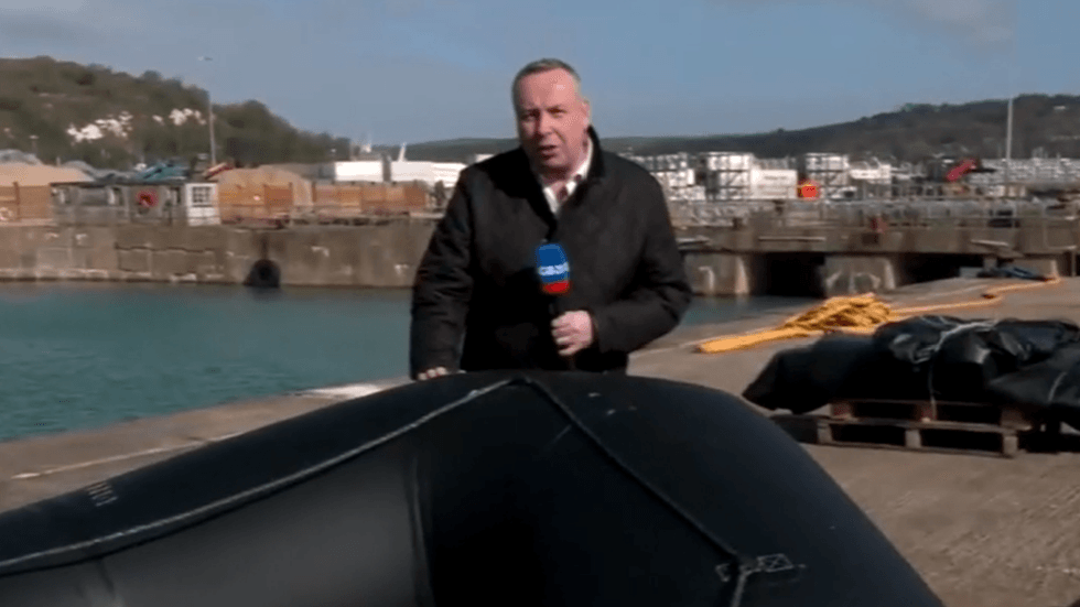 Mark Whte on the shores of Dover by small boat