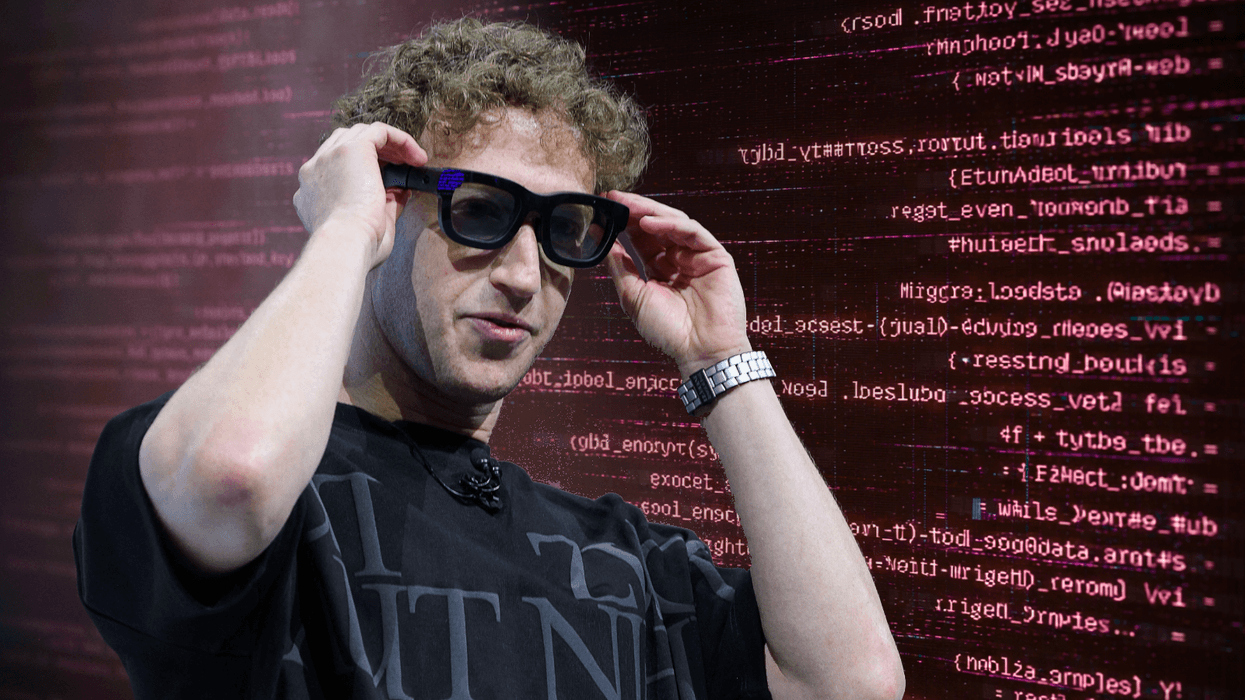 Mark Zuckerberg wearing Meta smart glasses with computer code displayed behind him