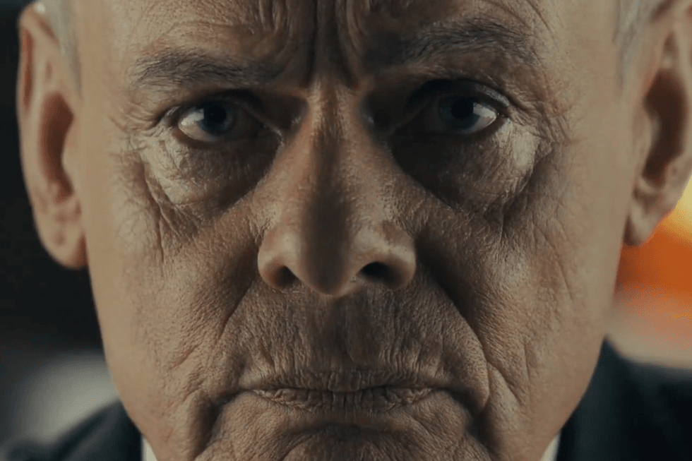 Martin Clunes as Huw Edwards