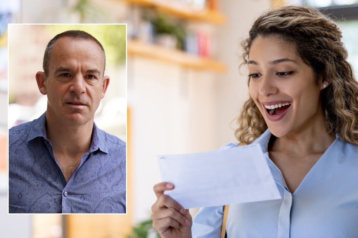 Martin Lewis and woman looking at letter