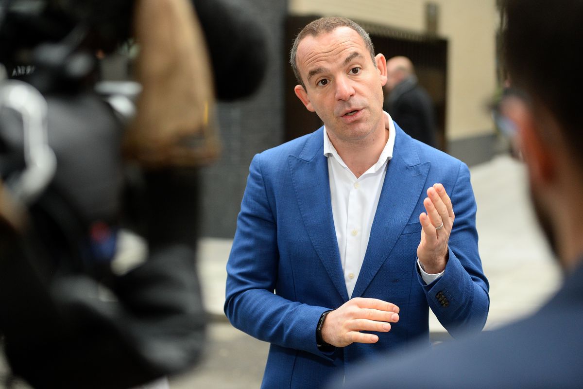 Martin Lewis talking to reporters