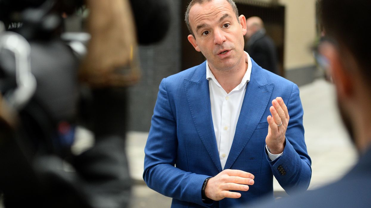 Martin Lewis talking to reporters