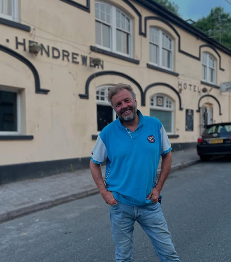 Martin Roberts in front of hotel