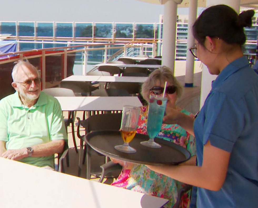 Marty and Jess Ansen receiving a drink