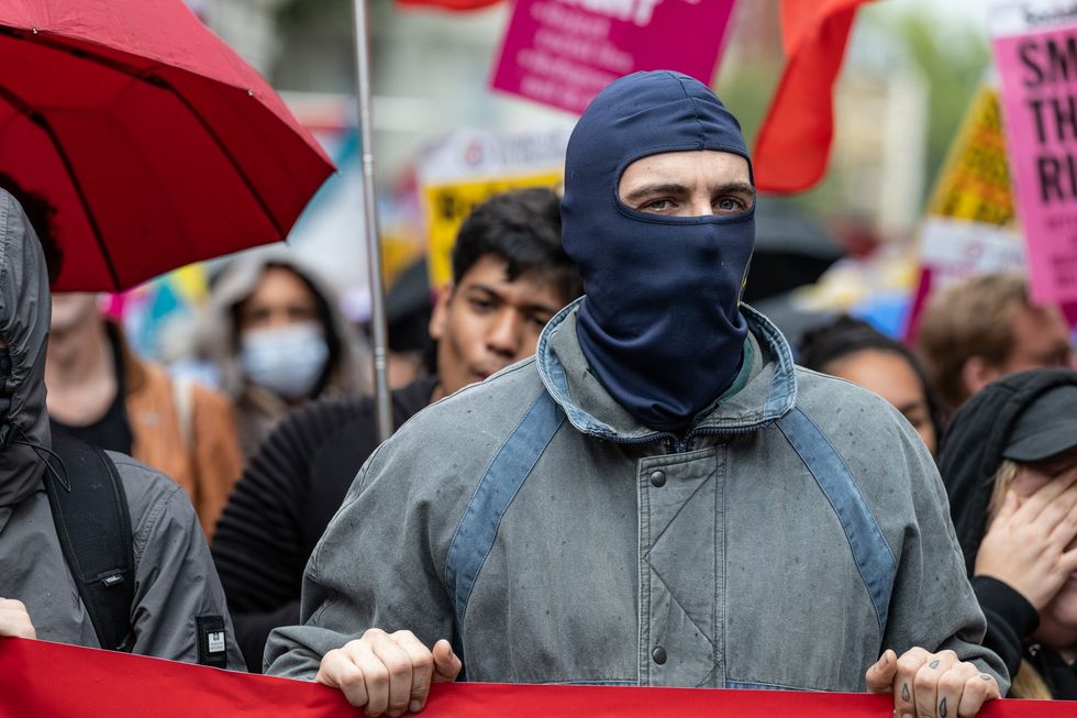 Masked protestor