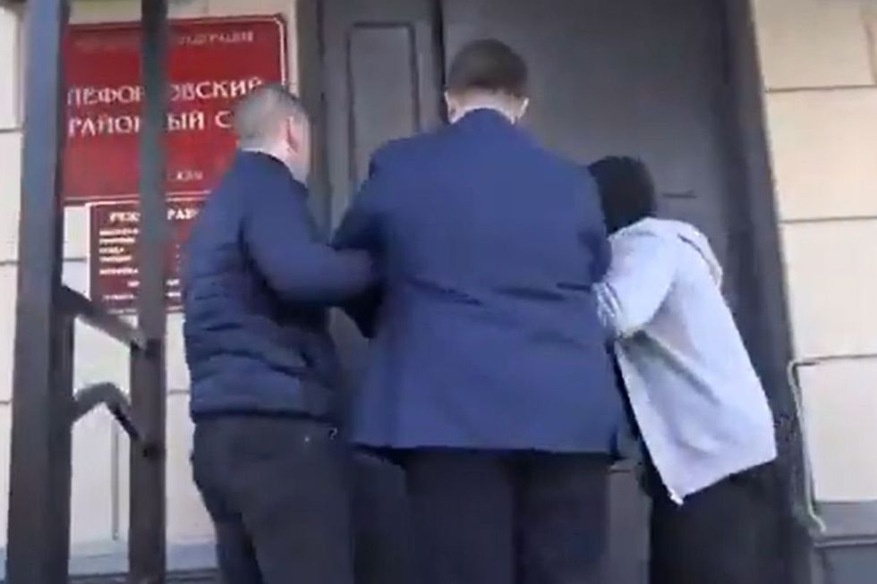 Masked security personnel subsequently escorted him to a holding cell at Moscow's Lefortovo District Court