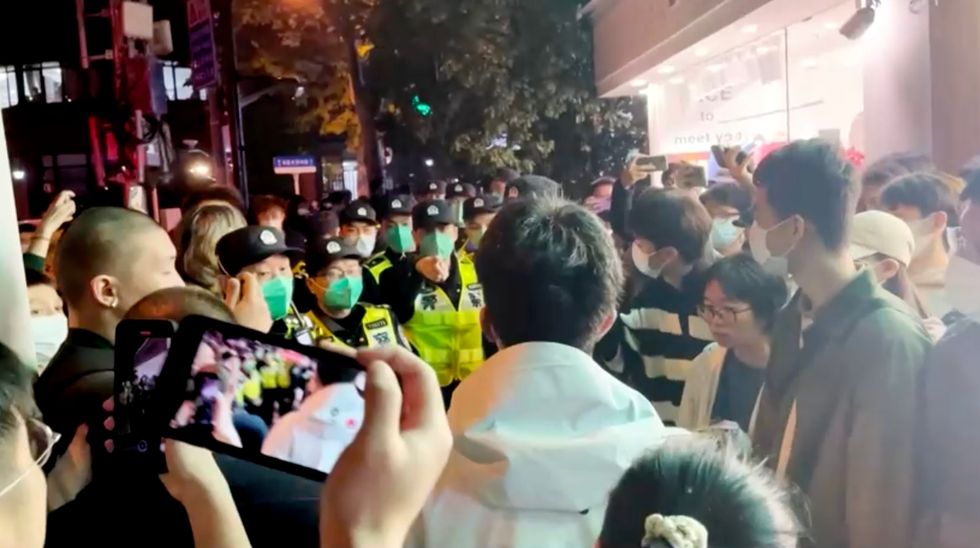 Mass protests sweep strict communist nation - Covid testing centres SMASHED as furious crowds chant 'down with Xi!'