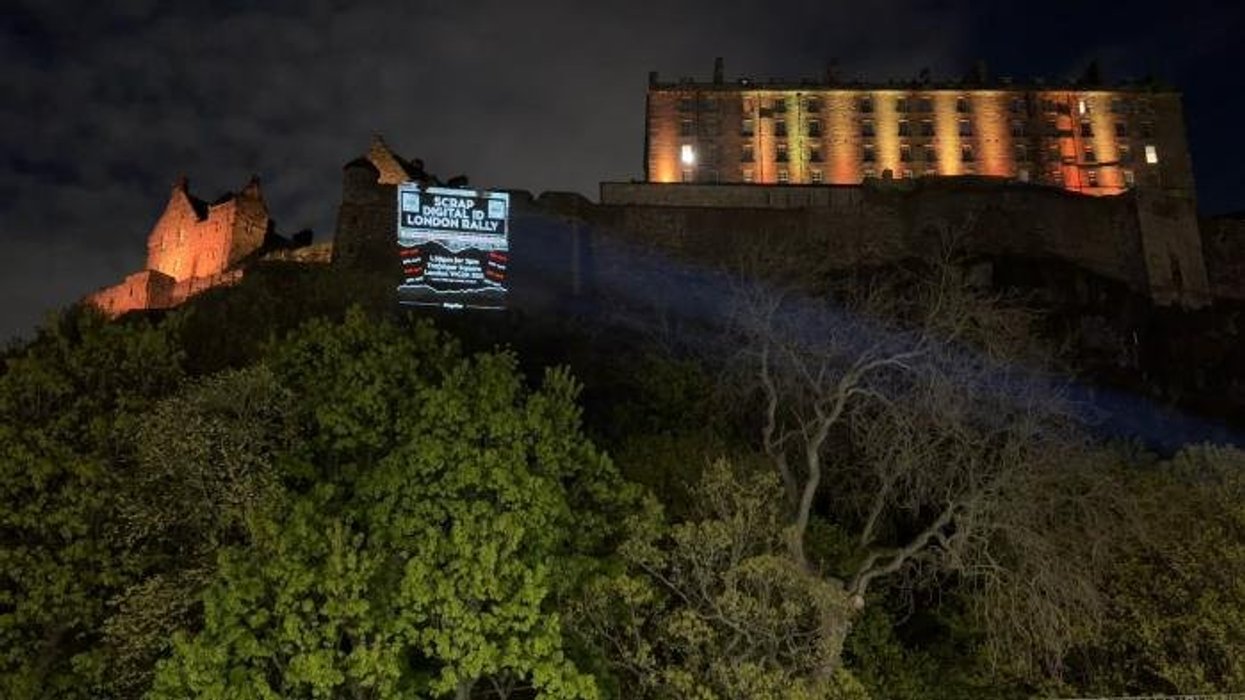 Massive anti-digital ID display projected onto historic Scottish landmark