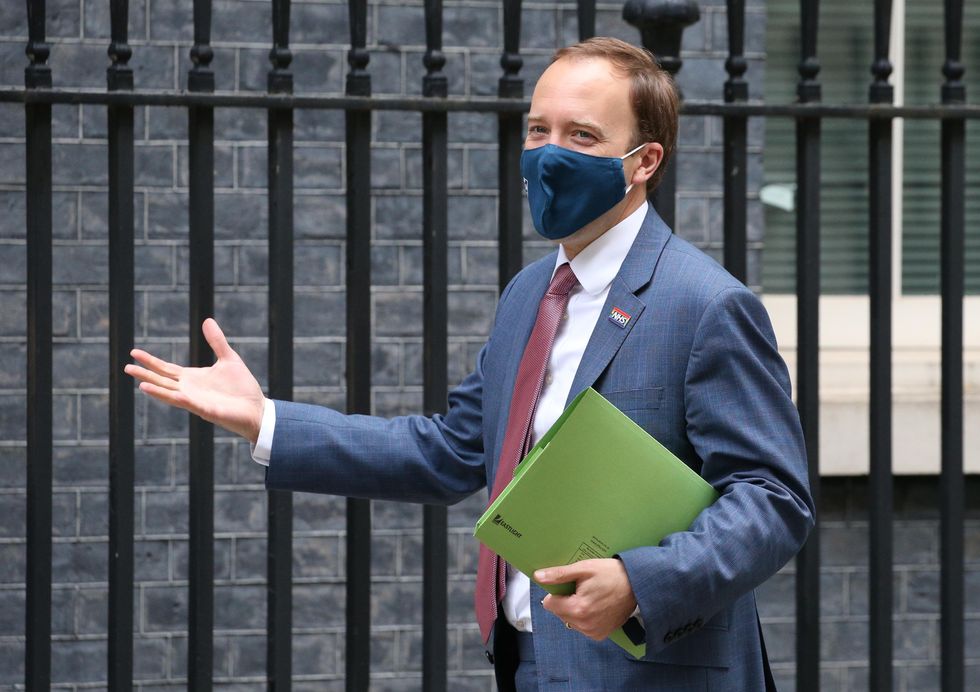 Matt Hancock arriving at Downing Street wearing a face mask during the pandemic