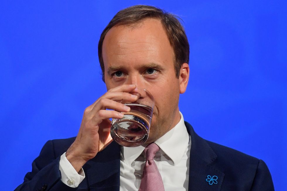 Matt Hancock sipping some water during a coronavirus briefing