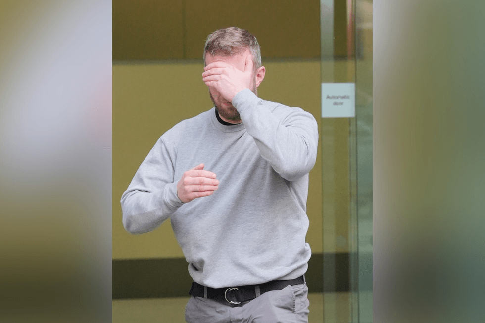 Matthew Trickett covers his face as he leaves Westminster Magistrates' Court\u200b
