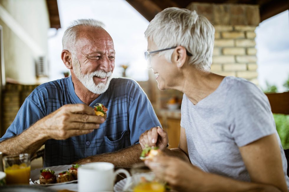 Mature couple eating breakfast