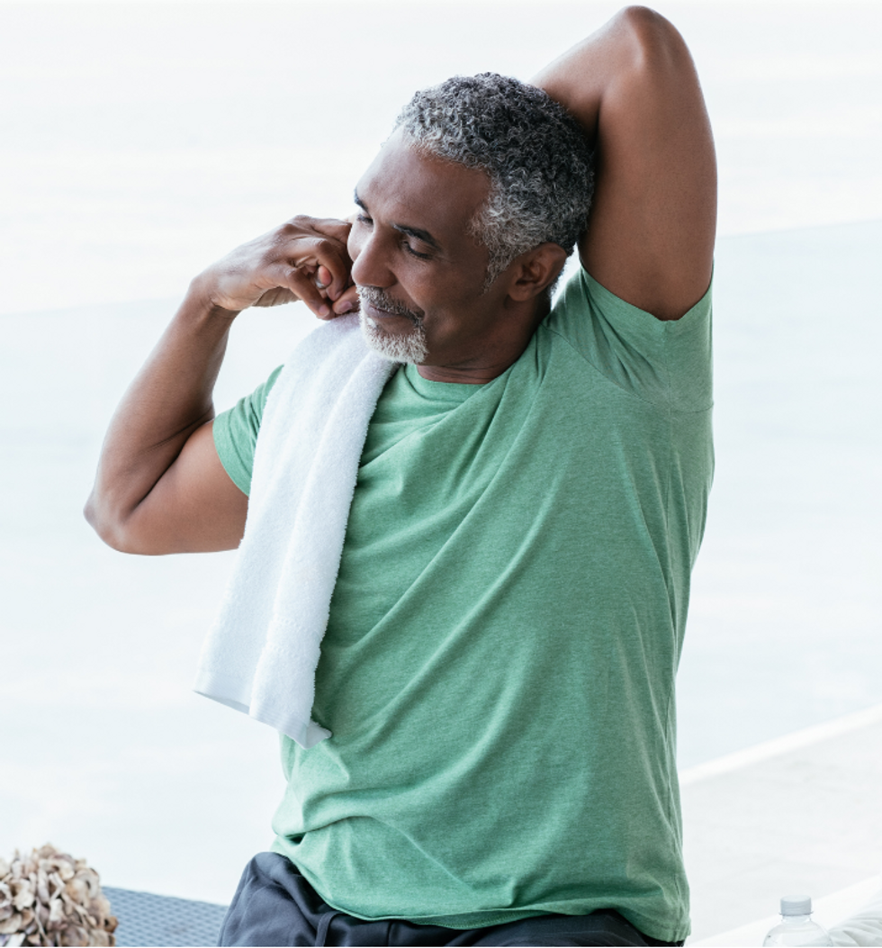 Mature man stretching