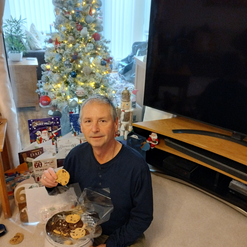Maurice from Sunderland tucking into some cookies from his Beverly Hills Bakery tin.