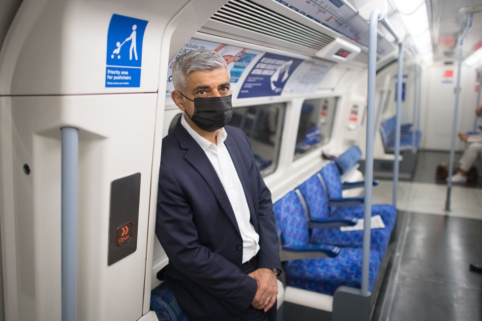 Mayor of London Sadiq Khan travels to City Hall by tube after travelling on the Waterloo and City Line underground line in London as it reopened for the first time since the start of the pandemic