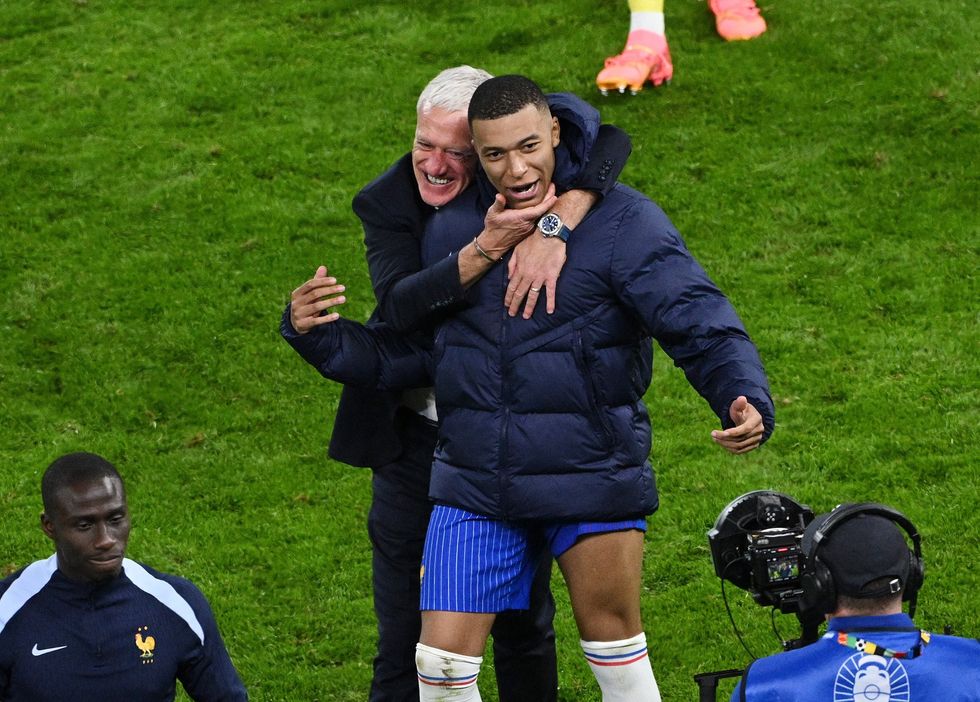 Mbappe and Deschamps after Portugal win