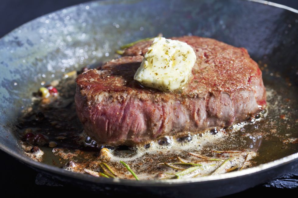 MEAT COOKING IN PAN
