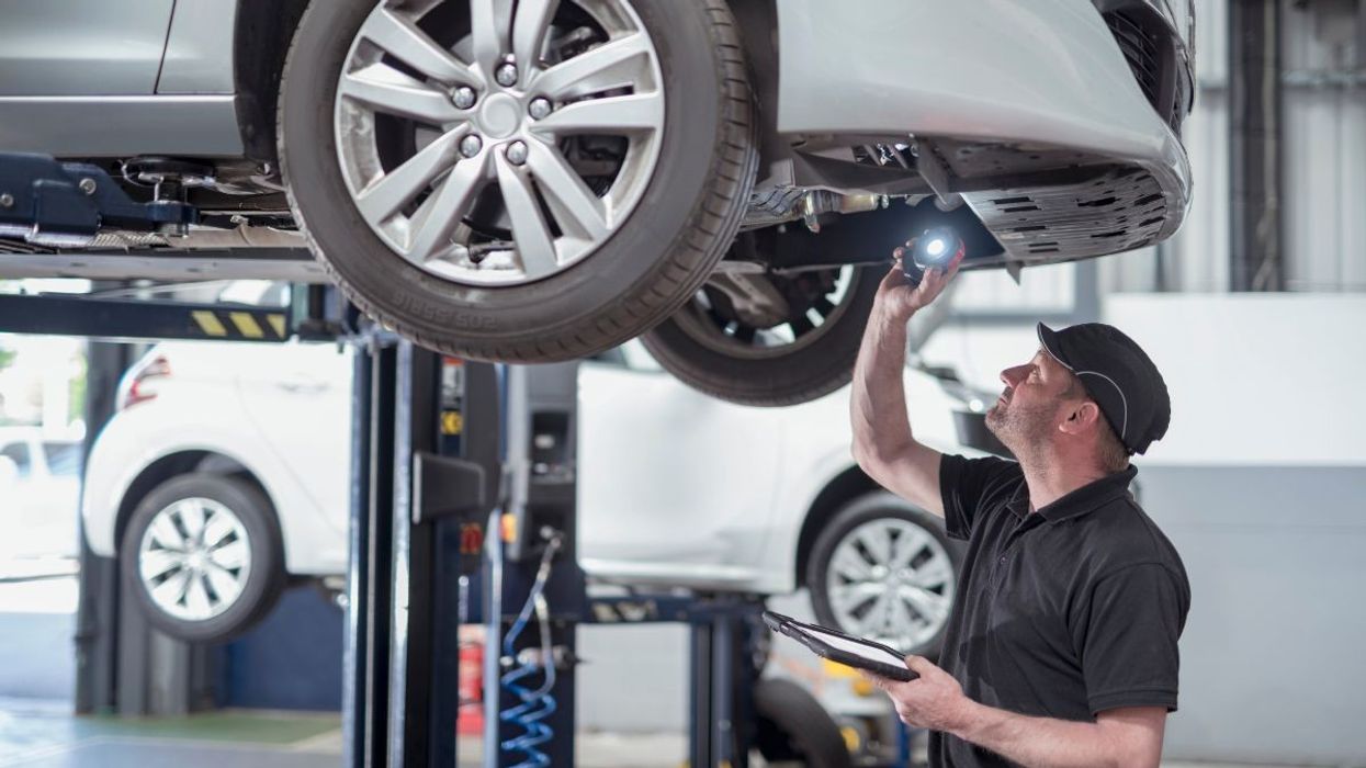 Mechanic performing an MOT test