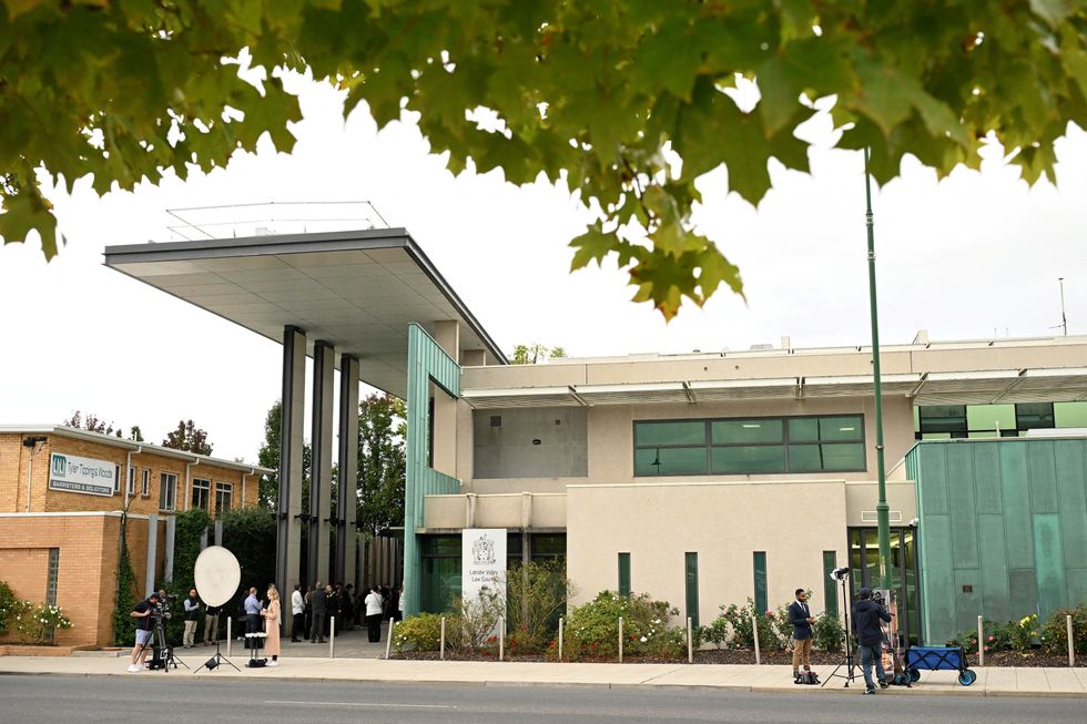 Media stand outside the Latrobe Valley Magistrates' Court in Morwell, Australia