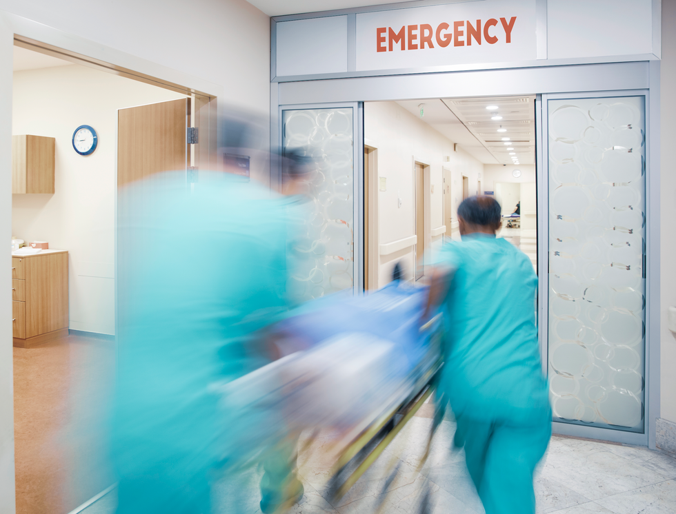 Medical personnel rushing through hospital